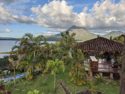 a view of a resort with a mountain in the background at Pie In The Sky 2 Luxury Home With Amazing Views! in El Castillo de La Fortuna