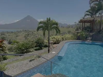 a swimming pool with a view of a mountain at Pie In The Sky 3 Stunning Lake & Volcano Views! in El Castillo de La Fortuna