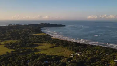 an aerial view of a beach and the ocean at Tierra Magnifica Boutique Hotel in Nosara
