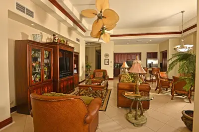 a living room with furniture and a ceiling fan at Bella Vista 4B 3 bdrs ocean view in Los Suenos in Herradura