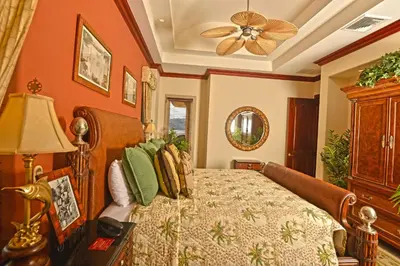 a bedroom with a bed and a ceiling fan at Bella Vista 4B 3 bdrs ocean view in Los Suenos in Herradura