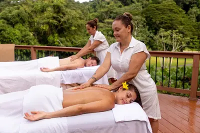 a masseur giving a woman a massage on four beds at Del Mar 3i 3 bdr Ocean View in Los Suenos in Herradura