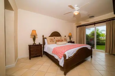 a bedroom with a bed and a ceiling fan at Del Mar 3N 3 bdr Garden View in Los Suenos in Herradura