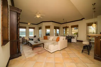 a living room with a couch and a table at Marbella 2A 3 bdr Ocean View in Los Suenos in Herradura