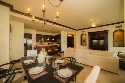 a living room with a table and a couch at Marbella 2A 3 bdr Ocean View in Los Suenos in Herradura
