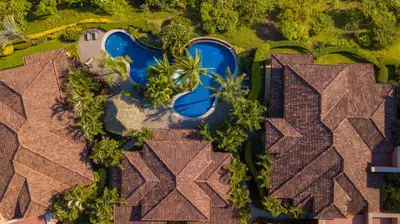 an overhead view of a house with a swimming pool at Marbella 3D 3 bdr Ocean View in Los Suenos in Herradura