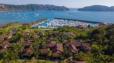 an aerial view of a resort with boats in the water at Marbella 3D 3 bdr Ocean View in Los Suenos in Herradura