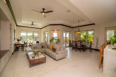 a living room with a couch and a table at Terrazas 1A 3 bdr Ocean View in Los Suenos in Herradura