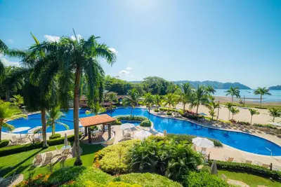 an aerial view of the pool at the resort at Terrazas 1A 3 bdr Ocean View in Los Suenos in Herradura