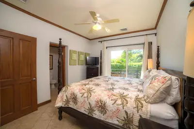 a bedroom with a bed and a window at Veranda 2B 3 bdr Golf Course View in Los Suenos in Herradura
