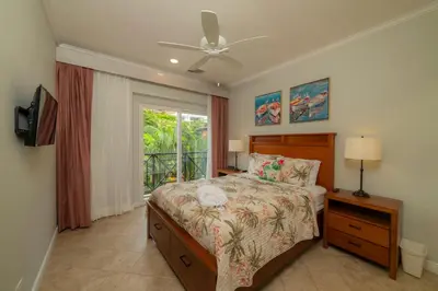 a bedroom with a bed and a window at Veranda 4B 3 bdr Golf Course View in Los Suenos in Herradura