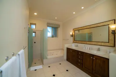 a bathroom with a sink and a shower and a mirror at Bella Vista 3F 3 bdr beach club view in Los Suenos in Herradura