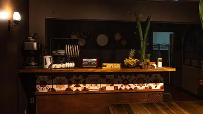 a counter in a kitchen with a table with food on it at awā San José in San José