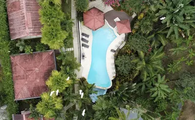 an overhead view of a swimming pool in a resort at The Scarlet Villas in Ojochal