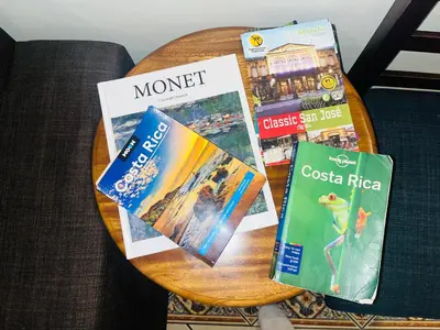 a table with some books on top of it at Ester`s Place in Escazu