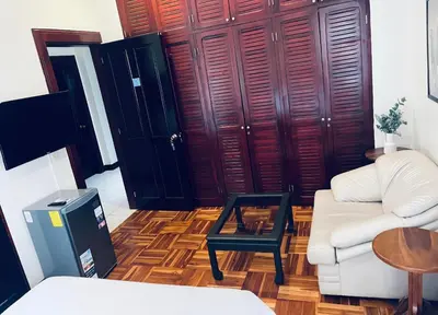 a living room with a couch and a coffee table at Ester`s Place in Escazu