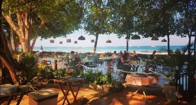 a restaurant with a view of the beach and the ocean at Tamarindo Condo 206 Matapalo in Tamarindo