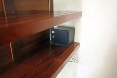 a television sitting on top of a wooden shelf at Nosara Paradise Rentals in Nosara