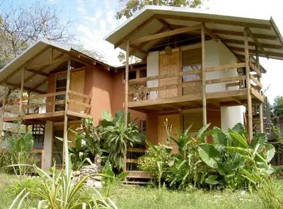 a building with a lot of balconies on it at Lodge El Barco in Esterillos