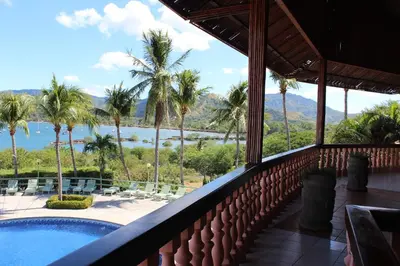 a view from the balcony of a resort with a swimming pool at Flamingo Marina Hotel in Playa Flamingo
