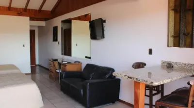 a living room with a couch and a table at Flamingo Marina Hotel in Playa Flamingo