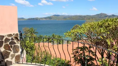 a balcony with a view of a beach and the ocean at Flamingo Marina Hotel in Playa Flamingo