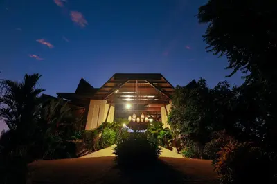 a building with lights in front of it at night at Hotel Three Sixty - Adults Only in Ojochal