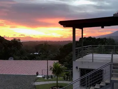 a view of a sunset from a house at Villas Lambeau 3 Ocean View - 2BR 3 BA in Uvita