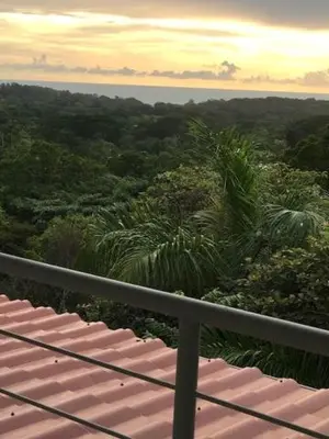 a view of the ocean from a balcony at Villas Lambeau 3 Ocean View - 2BR 3 BA in Uvita