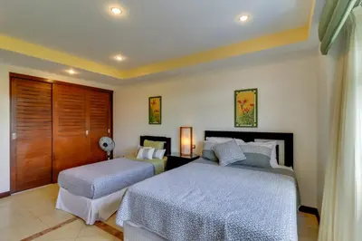 a bedroom with two beds in a room at Naxos 15 in Tamarindo