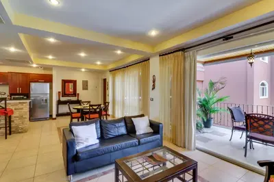 a living room with a couch and a table at Naxos 15 in Tamarindo
