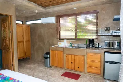 a kitchen with a sink and a counter top at Arbol Verde Villas in Ojochal