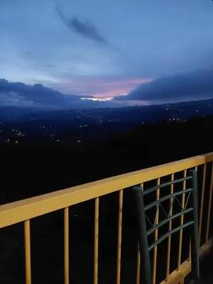 a view of the city from the top of the tower at night at Cabaña Niraj in Cartago