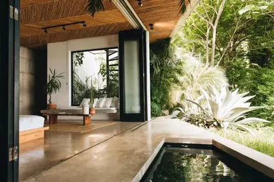 a house with a pool in the middle of a garden at Mint Santa Teresa - Adults only in Santa Teresa Beach