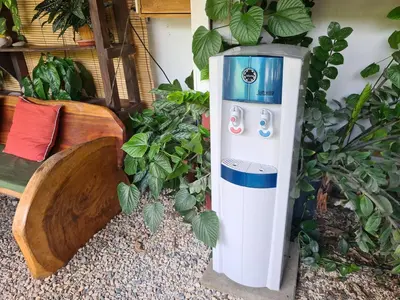 a white and blue water heater sitting next to a building at Trebolmar Apartments for remote work in Santa Teresa Beach