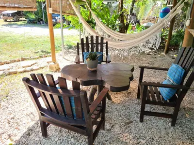 a group of chairs and a table and a hammock at Trebolmar Apartments for remote work in Santa Teresa Beach