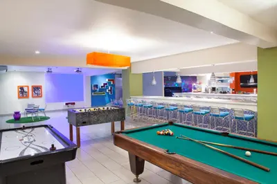 a billiard room with a pool table and a bar at Fiesta Resort All Inclusive Central Pacific - Costa Rica in El Roble