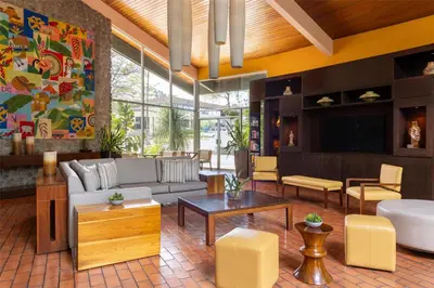 a living room with a couch and a table at Hilton Cariari DoubleTree San Jose - Costa Rica in San José
