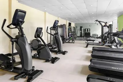 a gym with several treadmills and elliptical machines at Hilton Cariari DoubleTree San Jose - Costa Rica in San José