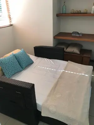 a room with a table and chairs with a table and a couch at 2Bed 2Bath Jaco Costa Linda in Jacó