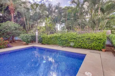 a swimming pool in a yard with trees at Aquamarine 4 in Guanacaste