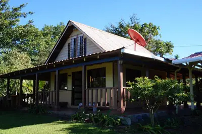 a small house with a pitched roof at La Flor de Loto in Cartago