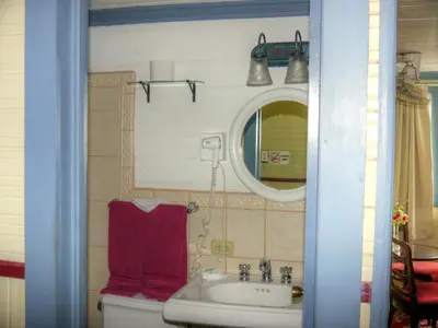 a bathroom with a sink and a mirror at Hotel Santo Tomas / Historical Property in San José