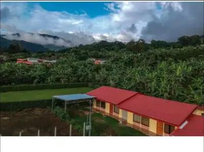 a house with a red roof on a hill at Casa en zona tranquila y rural in Higueronal