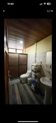a bathroom with a toilet and a sink at Casa en zona tranquila y rural in Higueronal