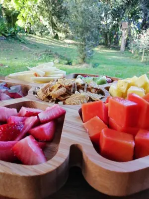 a tray of fruits and vegetables on a table at EYA Ecolodge in San Isidro