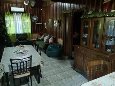 a living room with a table and a couch at Chalet Villa Vilma in San Mateo