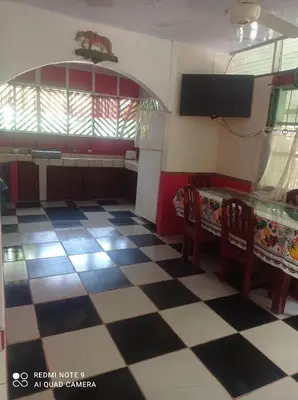 a kitchen with a black and white checkered floor at Coco verde in Coco