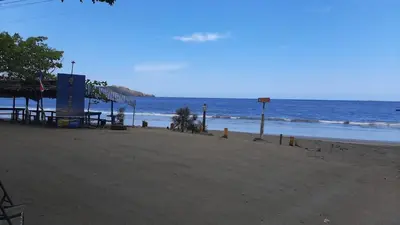 an empty beach with the ocean in the background at Hotel Brasilito in Brasilito