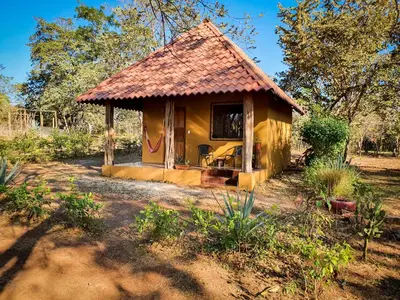 a small yellow house with a roof at Casa bungalow Ital-Tico in Paraíso